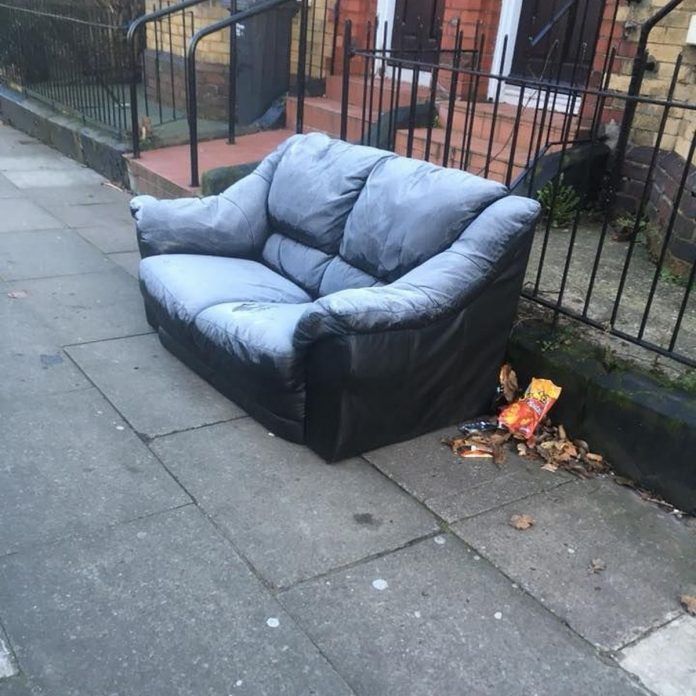 sofa outside rubbish